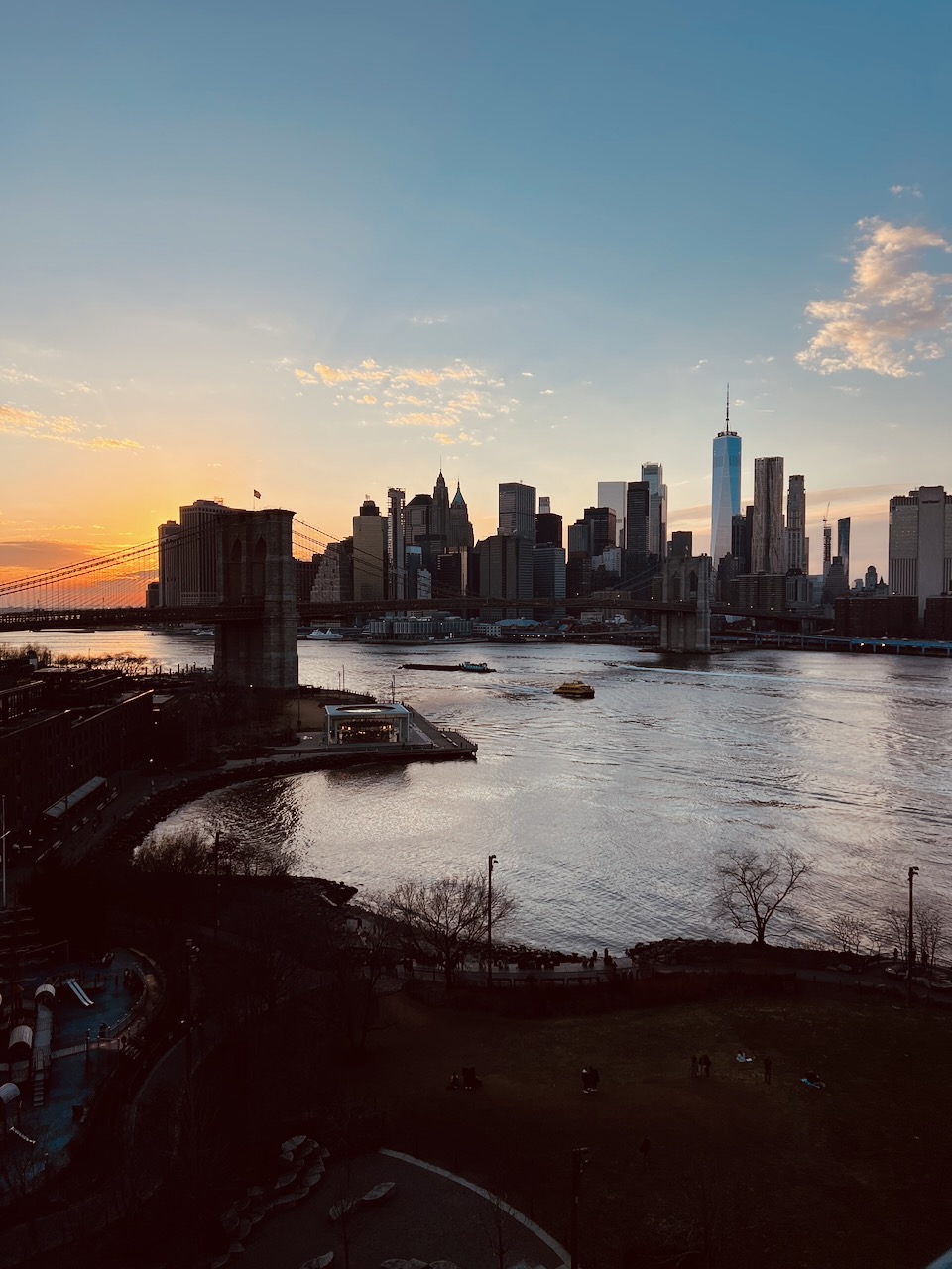 The Brooklyn Bridge and Manhattan skyline at sunset
